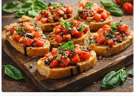 Toasted bread topped with tomatoes, basil and olive oil